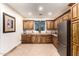 Kitchen featuring wooden cabinets, stainless steel refrigerator, recessed lighting and tiled floor at 23465 S 202Nd St, Queen Creek, AZ 85142