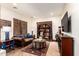 Cozy living room with hardwood floors, an oriental rug, and comfortable seating at 23465 S 202Nd St, Queen Creek, AZ 85142