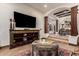 Comfortable living room with hardwood floors and stairs leading to the foyer at 23465 S 202Nd St, Queen Creek, AZ 85142