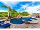 Backyard features a lagoon style pool with a waterfall feature at 23465 S 202Nd St, Queen Creek, AZ 85142