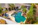 Aerial view of a beautiful pool with a slide, jacuzzi, and lush tropical landscaping at 23465 S 202Nd St, Queen Creek, AZ 85142