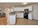 Well-lit kitchen featuring modern appliances, ample counter space, and stylish backsplash at 2366 E Spruce Dr, Chandler, AZ 85286