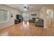 Comfortable living room features wood flooring, neutral paint, and ample natural light at 2366 E Spruce Dr, Chandler, AZ 85286