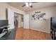 View of the office featuring wood floors and a connection to an adjacent living room at 2366 E Spruce Dr, Chandler, AZ 85286