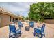 Lovely backyard with a cozy seating area around a fire pit, perfect for outdoor entertaining and relaxation at 2405 E Lynwood Cir, Mesa, AZ 85213