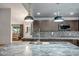 Modern kitchen featuring granite countertops, mosaic tile backsplash, and stylish pendant lighting at 2405 E Lynwood Cir, Mesa, AZ 85213