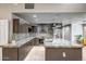 Well-lit kitchen features custom cabinets, granite countertops, and stainless steel appliances at 2405 E Lynwood Cir, Mesa, AZ 85213