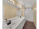 Bright bathroom features a double sink vanity and a shower over a tub at 2521 N Franz Ln, Casa Grande, AZ 85122