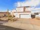 Charming two-story home featuring desert landscaping, a two-car garage, and solar panels at 2521 N Franz Ln, Casa Grande, AZ 85122