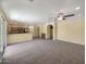 Inviting living space featuring carpet, tile, modern appliances, and natural light at 2521 N Franz Ln, Casa Grande, AZ 85122