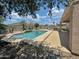 Backyard featuring a refreshing pool with a tanning ledge and bar at 2521 N Franz Ln, Casa Grande, AZ 85122