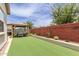 Well-maintained backyard with synthetic grass, landscaping, and a gazebo, great for outdoor activities at 2605 S Quaintance St, Gilbert, AZ 85295