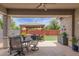 Outdoor patio features a gazebo, dining area, and well-manicured artificial grass at 2605 S Quaintance St, Gilbert, AZ 85295