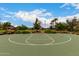 Green and white outdoor community basketball court offers a place for recreation and exercise at 2605 S Quaintance St, Gilbert, AZ 85295