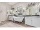 Elegant bathroom features double vanity sinks, a freestanding tub, sconce lighting, and modern fixtures at 2605 S Quaintance St, Gilbert, AZ 85295