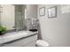 Bright bathroom with granite countertops, modern fixtures, and framed artwork on the wall at 2605 S Quaintance St, Gilbert, AZ 85295