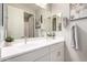 Bright bathroom featuring double sinks, ample mirror space, and elegant fixtures at 2605 S Quaintance St, Gilbert, AZ 85295
