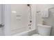 Clean bathroom featuring a shower-tub combination, neutral color scheme, and modern hardware at 2605 S Quaintance St, Gilbert, AZ 85295
