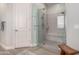 Contemporary bathroom boasts a glass-enclosed shower with bench seating and modern fixtures, providing a spa-like experience at 2605 S Quaintance St, Gilbert, AZ 85295