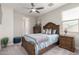 Comfortable bedroom featuring soft carpet, neutral paint, and coordinated furnishings and decor at 2605 S Quaintance St, Gilbert, AZ 85295