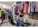 Walk-in closet featuring custom shelving to organize clothes, shoes, and accessories neatly at 2605 S Quaintance St, Gilbert, AZ 85295