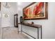 Elegant foyer with high ceilings, stylish console table, and striking artwork at 2605 S Quaintance St, Gilbert, AZ 85295