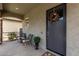 Welcoming front porch with seating, a stylish wreath, and a decorative plant at 2605 S Quaintance St, Gilbert, AZ 85295