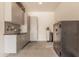 Functional garage area featuring gray cabinets, shelving and a safe, offering secure and organized storage options at 2605 S Quaintance St, Gilbert, AZ 85295