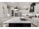 Modern kitchen featuring a large island, stainless steel appliances, and pendant lighting at 2605 S Quaintance St, Gilbert, AZ 85295