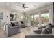 Comfortable living room showcasing a neutral color palette, plush seating, and access to the outdoor patio at 2605 S Quaintance St, Gilbert, AZ 85295