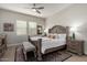 Serene main bedroom suite with a decorative bed frame, soft lighting, and a neutral color scheme at 2605 S Quaintance St, Gilbert, AZ 85295