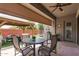 Inviting outdoor patio with comfortable seating and covered gazebo with green synthetic grass at 2605 S Quaintance St, Gilbert, AZ 85295