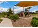Community playground with covered play structure, mature trees, and landscaping at 2605 S Quaintance St, Gilbert, AZ 85295