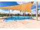 Community pool featuring a splash area with slides, and ample seating, perfect for Gathering fun in the sun at 2605 S Quaintance St, Gilbert, AZ 85295