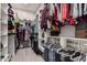 Spacious walk-in closet featuring extensive shelving and hanging rods for organized storage of clothes and accessories at 2605 S Quaintance St, Gilbert, AZ 85295