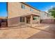 Home's backyard with a covered patio, stucco exterior, and potential for creating an outdoor oasis at 2652 E Riviera Dr, Chandler, AZ 85249