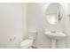 Bright powder room features white fixtures at 2652 E Riviera Dr, Chandler, AZ 85249