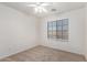 Bright bedroom with carpeted flooring and a window providing natural light at 2652 E Riviera Dr, Chandler, AZ 85249