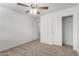 Bedroom featuring carpeted flooring, closet and an entry door at 2652 E Riviera Dr, Chandler, AZ 85249