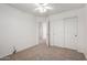 Bedroom featuring carpeted flooring, closet and an entry door at 2652 E Riviera Dr, Chandler, AZ 85249