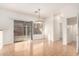 Bright living room featuring a sliding glass door, hardwood floors, and neutral colors at 2652 E Riviera Dr, Chandler, AZ 85249