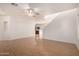 A spacious living room with hardwood floors, ceiling fan, and a minimalist design at 2652 E Riviera Dr, Chandler, AZ 85249