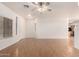 Comfortable living space with hardwood flooring, a ceiling fan, and plenty of natural light at 2652 E Riviera Dr, Chandler, AZ 85249