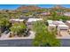 Home in a desert community with cacti, mature landscaping, and mountains in the background at 27892 N 108Th Way, Scottsdale, AZ 85262