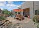 Expansive backyard with a pool, patio, outdoor seating, and lush desert landscaping at 27892 N 108Th Way, Scottsdale, AZ 85262