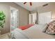 Comfortable bedroom featuring neutral tones and a view to an ensuite bathroom and closet at 27892 N 108Th Way, Scottsdale, AZ 85262