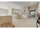 Bright hallway featuring custom built-ins and an open view to a bedroom with plantation shutters at 27892 N 108Th Way, Scottsdale, AZ 85262