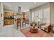 Eat-in kitchen offers stainless steel appliances, wood cabinets, tile backsplash, and recessed lighting, with seating area nearby at 27892 N 108Th Way, Scottsdale, AZ 85262