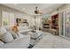 Bright living room featuring a fireplace, comfortable seating, and views of the outdoors at 27892 N 108Th Way, Scottsdale, AZ 85262