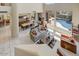 Open-concept living room showcasing pool views and elegant furnishings, creating an inviting space at 27892 N 108Th Way, Scottsdale, AZ 85262